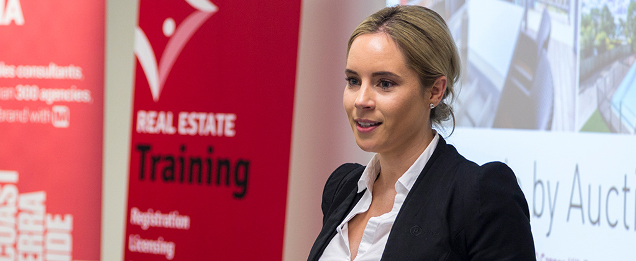 Woman presenting in front of screen