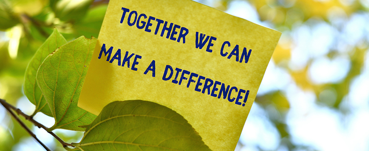 Yellow postit note in tree with words