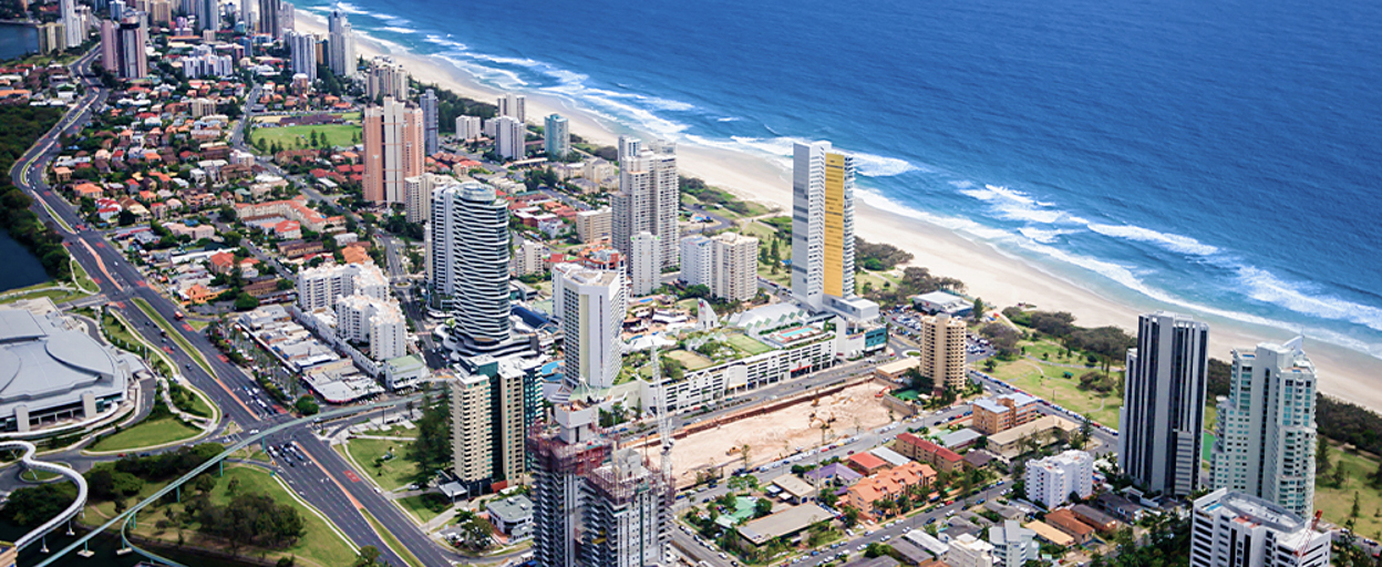 aerial view of coastal suburb with ocean