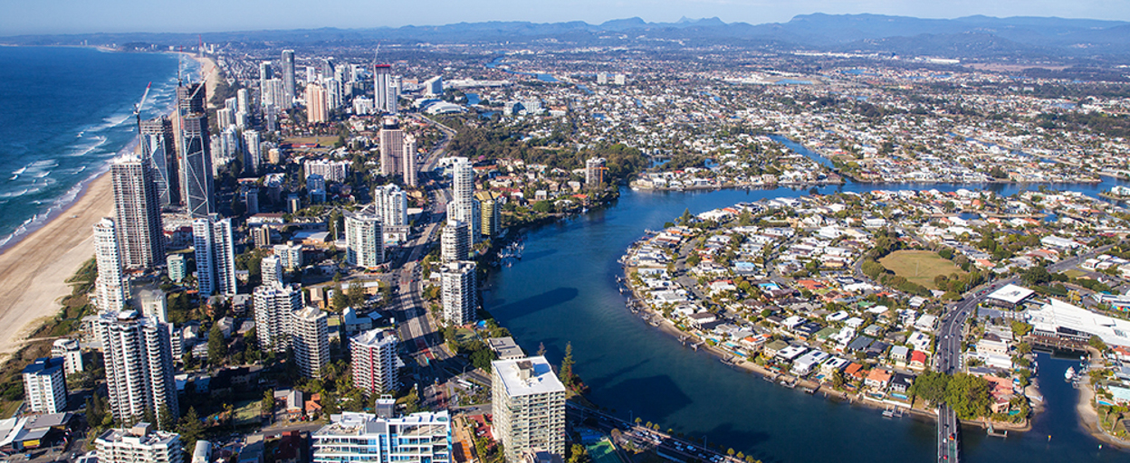 aerial view of coastal suburbs next to ocean and river