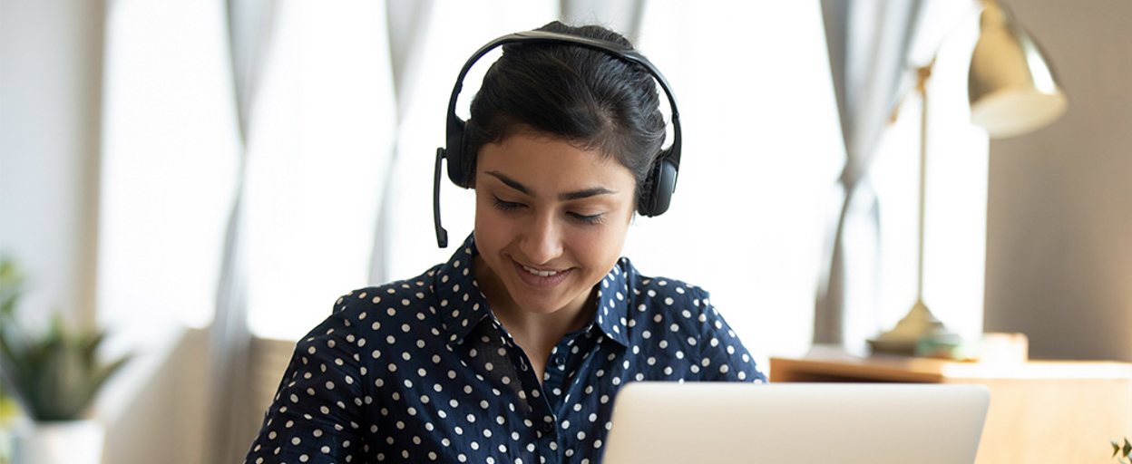 A person writing in a notebook