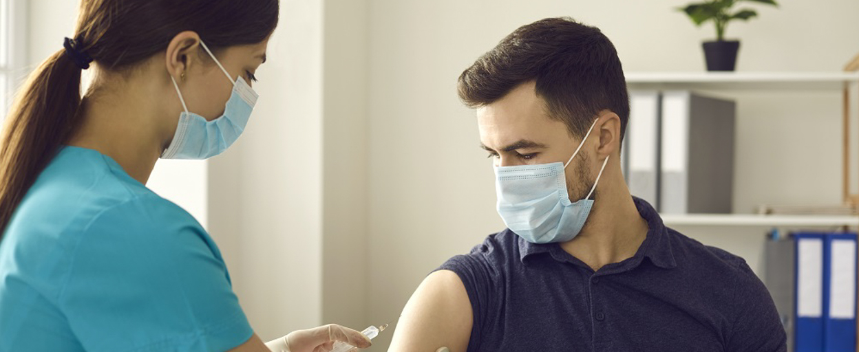 Administering a COVID jab