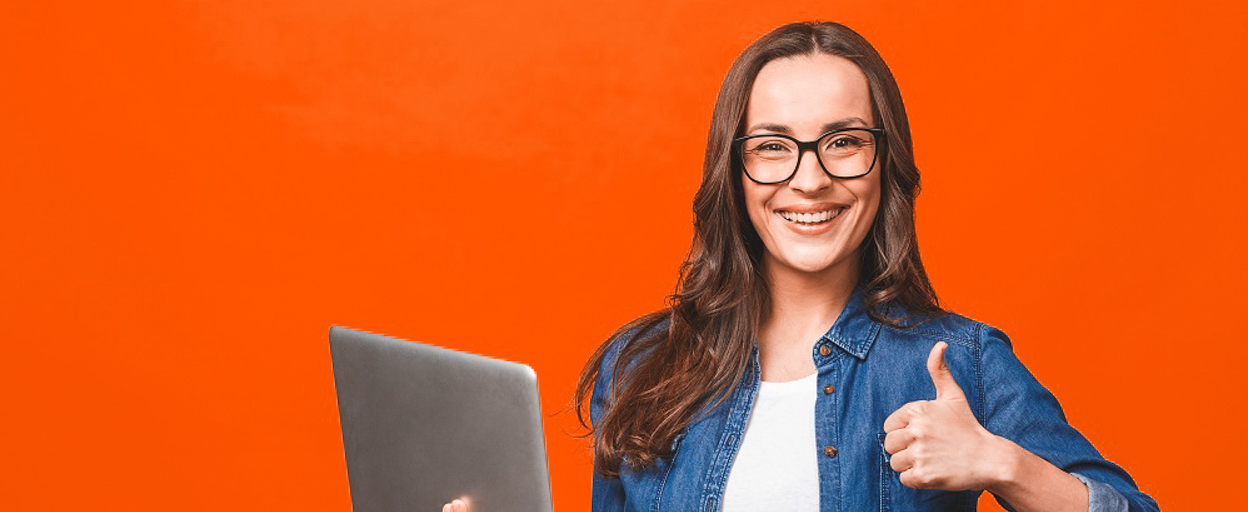 Woman at laptop giving thumbs up