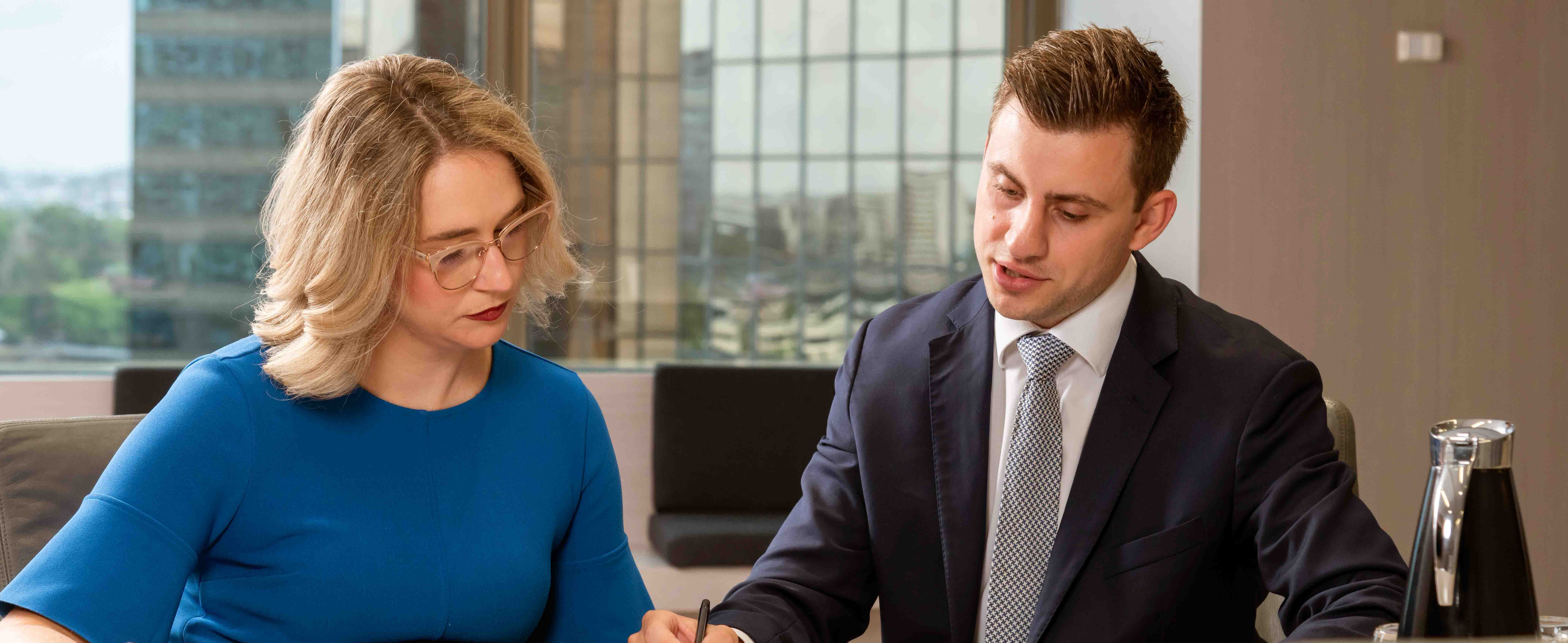 Paperwork being discussed with a commercial agent